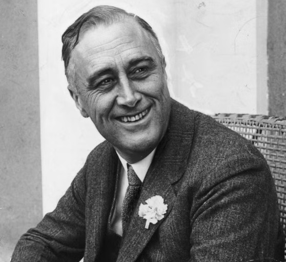Franklin Delano Roosevelt smiling when he heard that he was leading the contest for Governor of New York State.